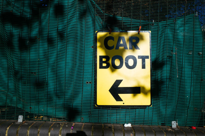 Car boot sale sign on a wall
