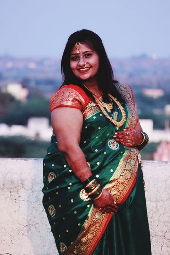 Portrait of smiling woman wearing sari outdoors