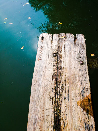 High angle view of wooden post on lake