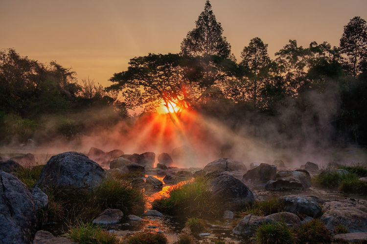 Morning fog over hot spring at chae sorn national park, thailand
