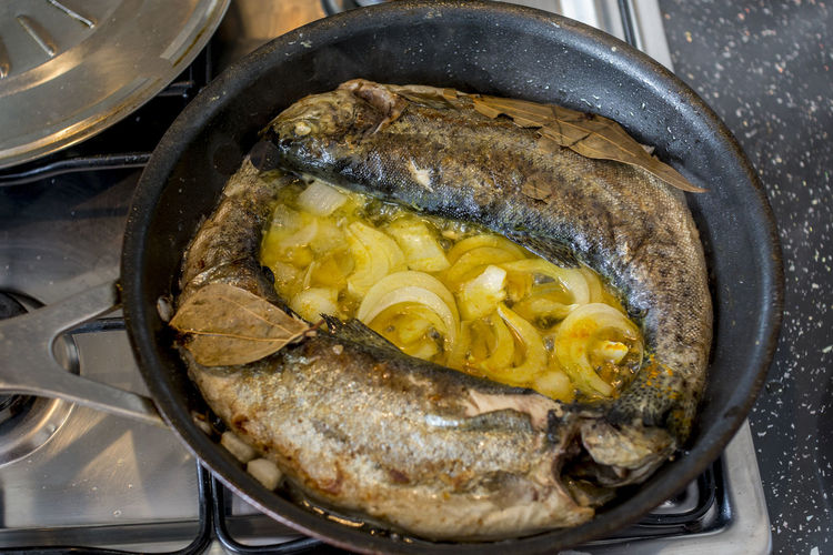High angle view of fish in skillet