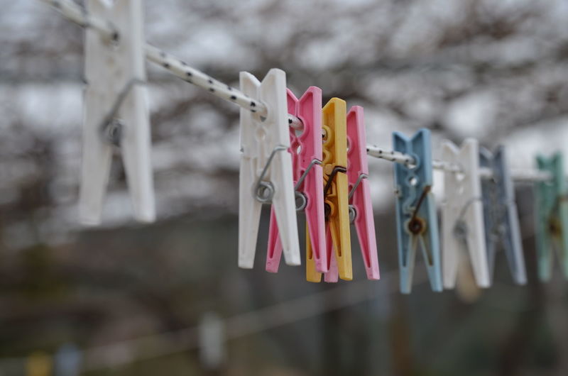Close-up of padlocks hanging on clothesline