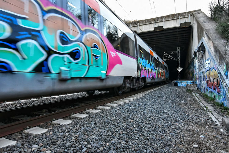 Graffiti on train at railroad station platform
