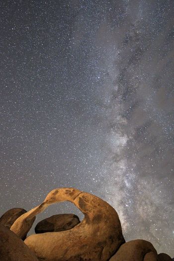 Low angle view of mobius arch against sky at night