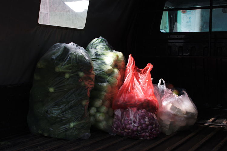Vegetables in plastic bags at truck