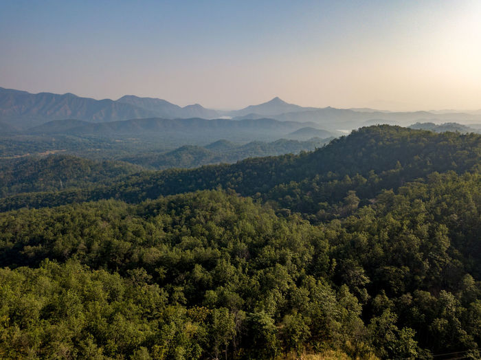High angle view of trees and mountains against sky