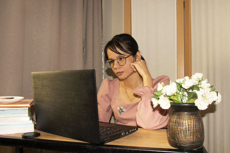 Women use laptops in the office stressfully