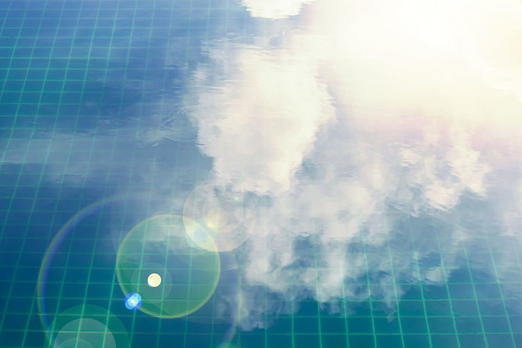 Digital composite image of swimming pool against sky
