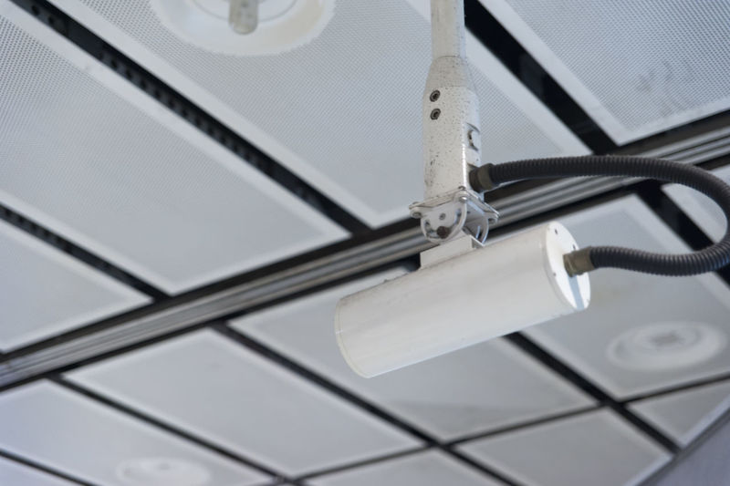 Low angle view of security camera on ceiling