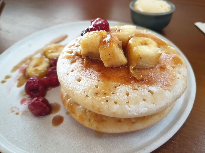 Close-up of pancakes in plate on table