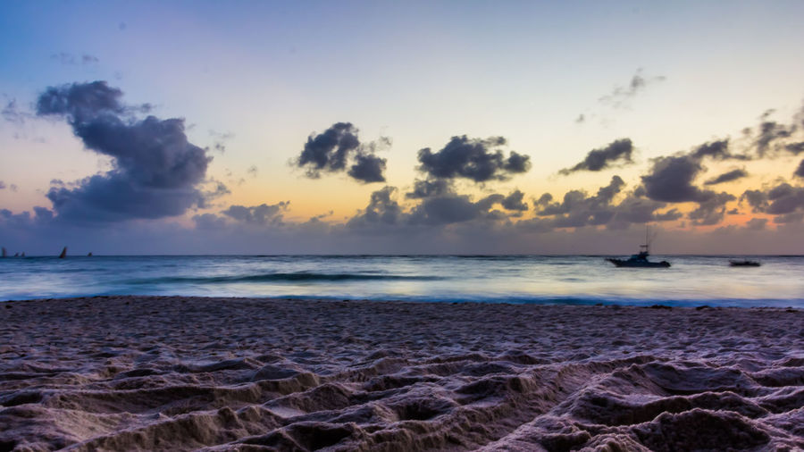 Scenic view of sea against sky at sunset