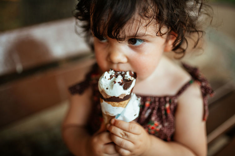 Close-up of cute child holding ice cream
