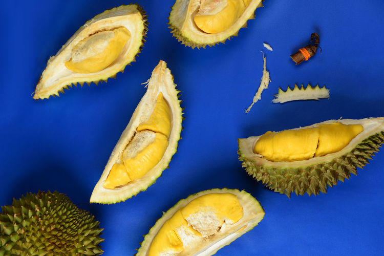 Close-up of fruits against blue background