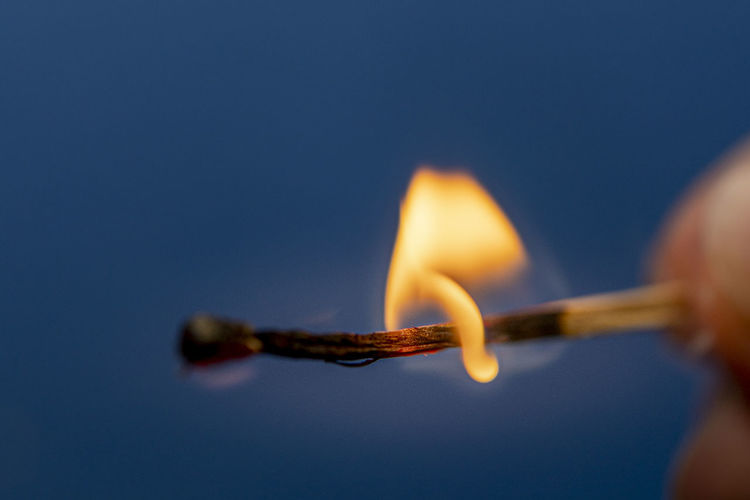 Close-up of burning matchstick 