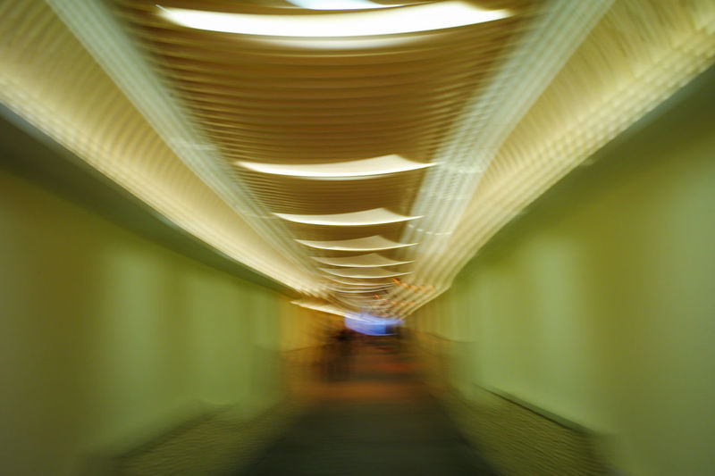 Blurred motion of illuminated lights in building