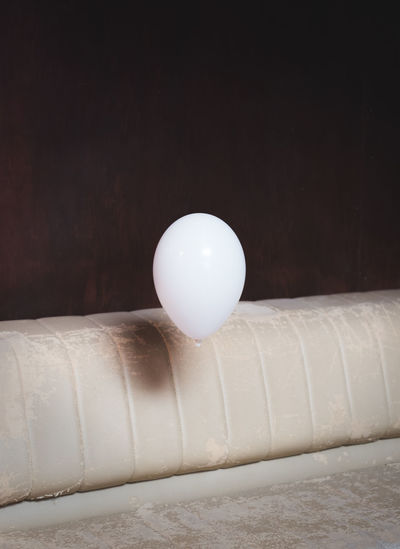 Balloon in mid-air over sofa