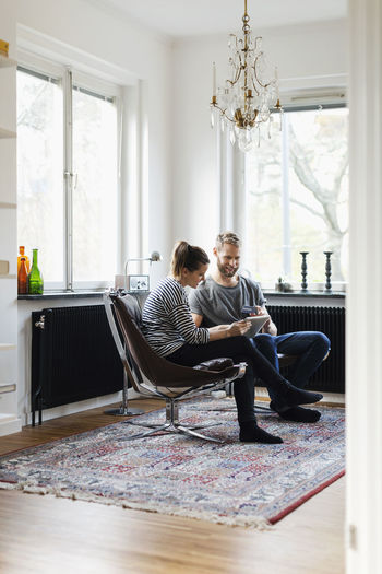 Couple sitting on floor at home