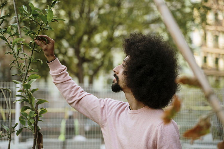 Man holding plant