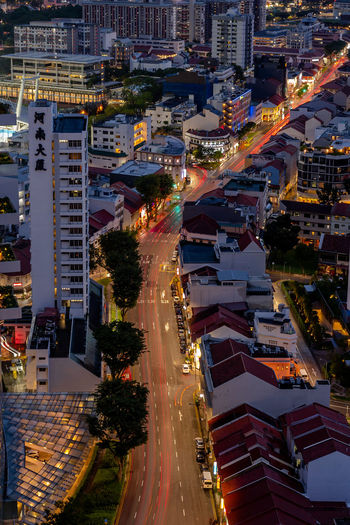 High angle view of illuminated buildings in city