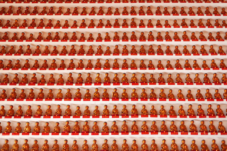 Sha tin, hong kong, china, asia - many little buddhas statues at the 10000 buddhas temple.