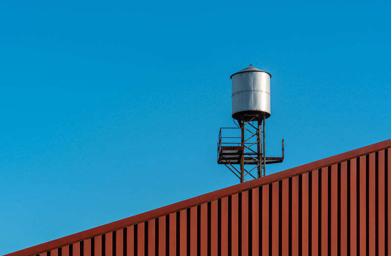 Low angle view of built structure against clear blue sky