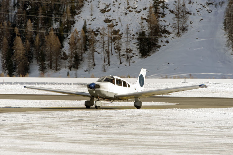 Airplane on snow covered field