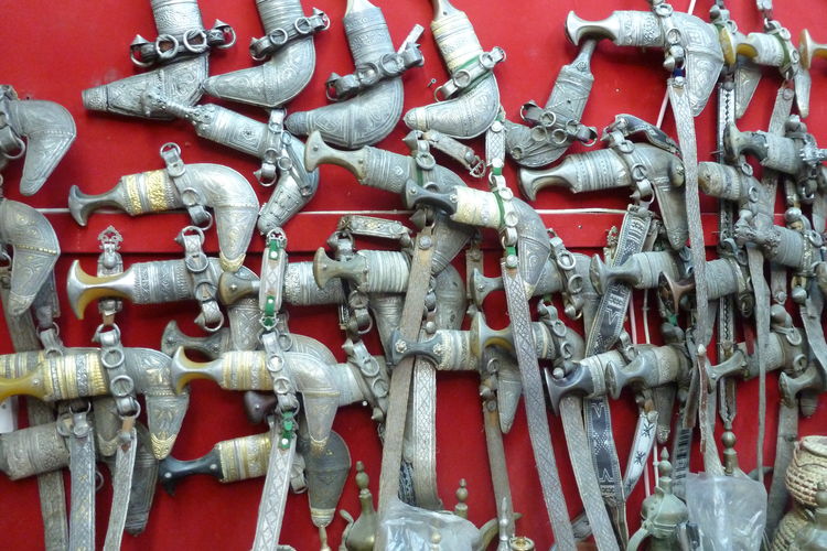 Full frame shot of daggers on display at the nizwa market in oman