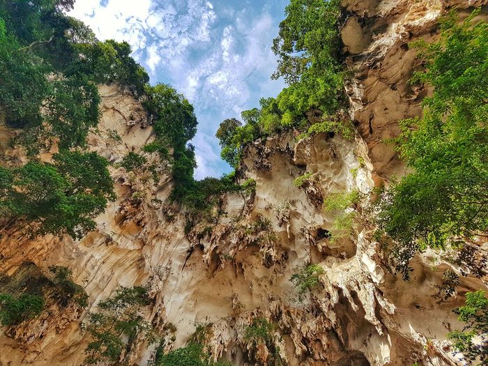 Low angle view of mountain at batu caves