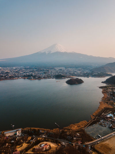 Scenic view of lake kawaguchi and mt fuji against sky during sunset