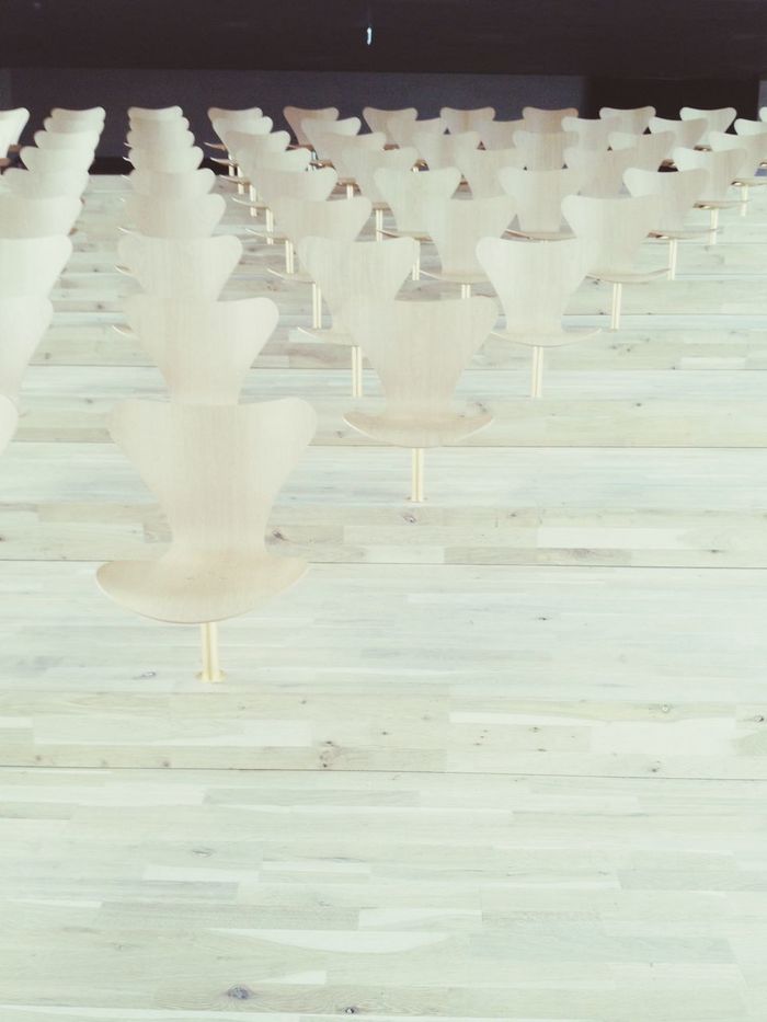 Empty chairs on wooden floor