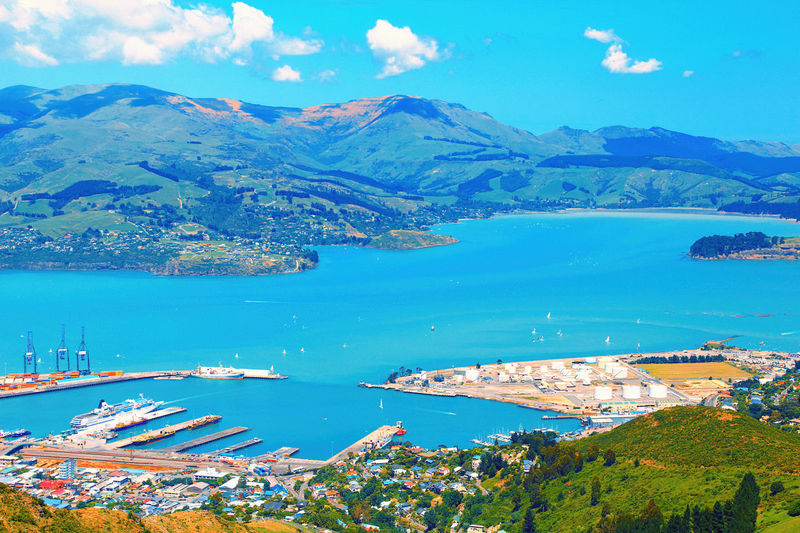 Scenic view of sea and mountains against sky