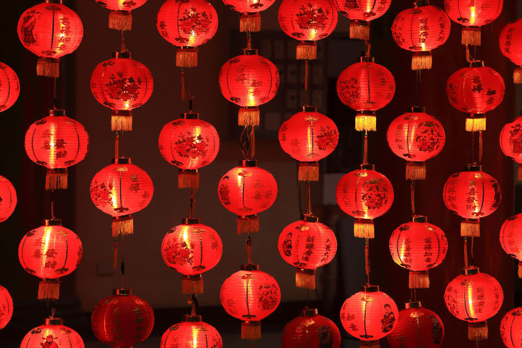 Full frame shot of lanterns hanging at night