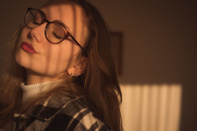 Close-up of young woman wearing eyeglasses
