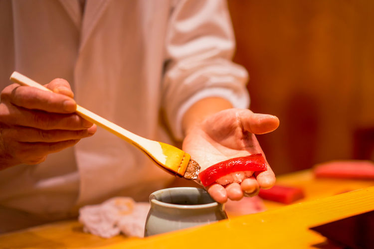 Close-up of chef preparing sushi