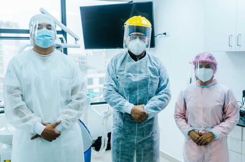 Doctors wearing mask standing in hospital