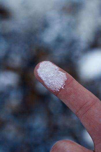 Close-up of powder on finger