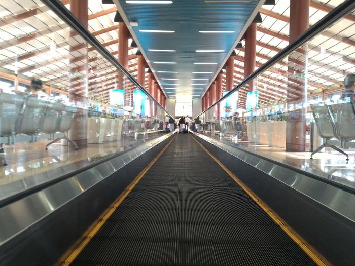 Illuminated railroad station platform at airport