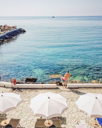 People relaxing on beach