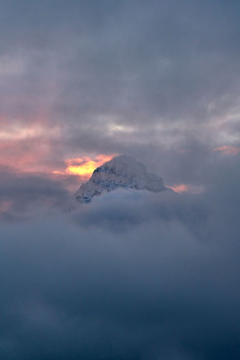Scenic view of snowcapped mountain against sky during sunset