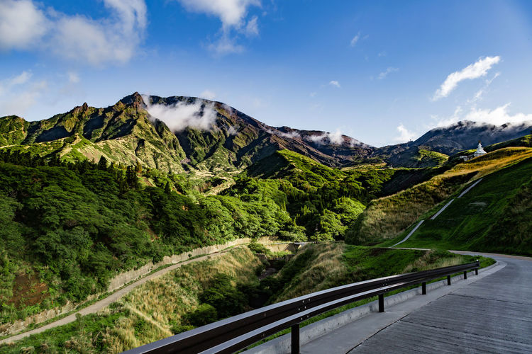 View on a road among mountains near aso volcano in kyushu, japan