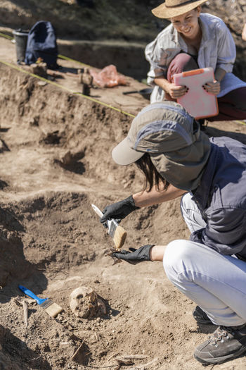 Archaeologist working at archaeology site
