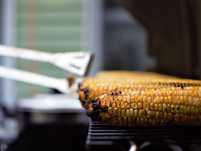 Close-up of corn on barbecue grill