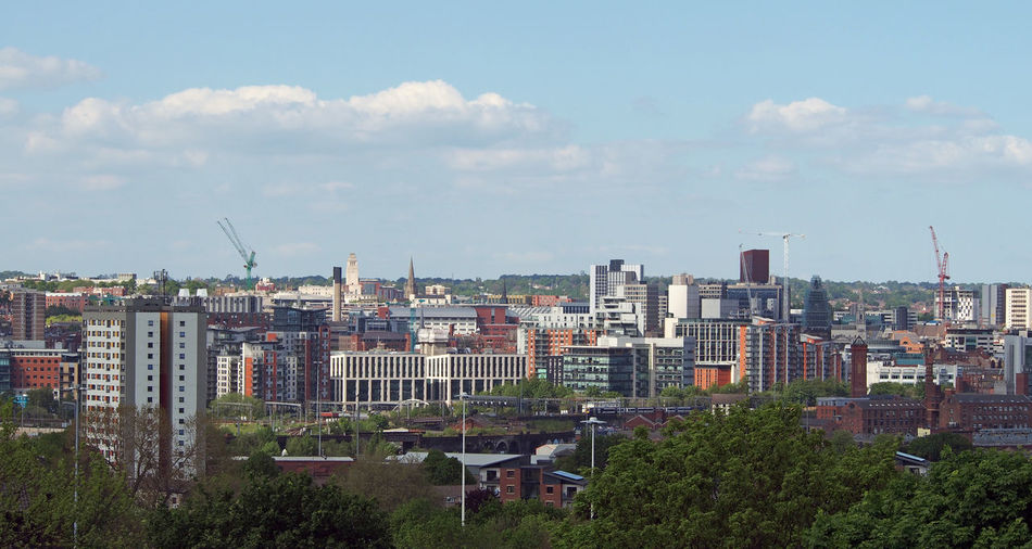 High angle view of buildings in city against sky