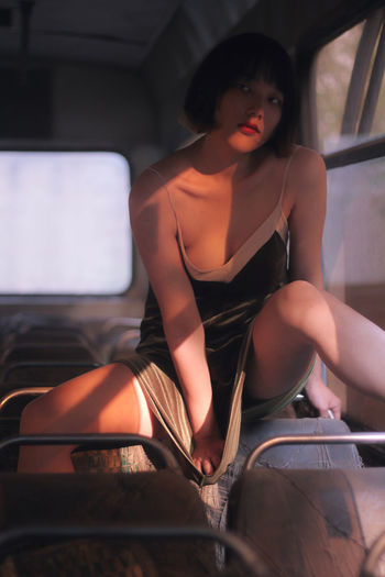 Sensuous woman sitting in bus