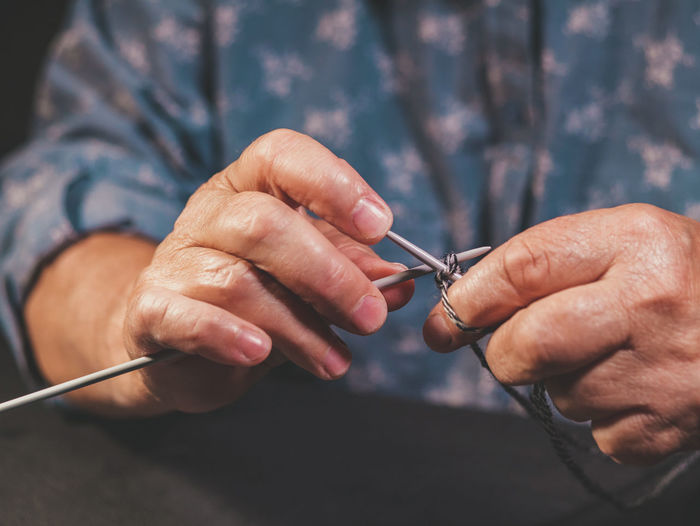 Close-up of man holding hands