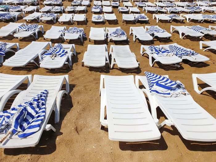High angle view of chairs on beach