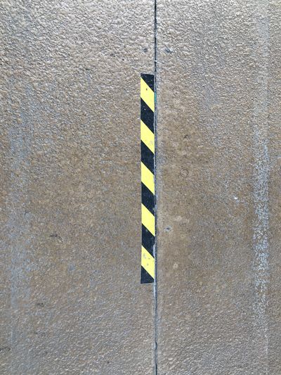 High angle view of yellow flag on road