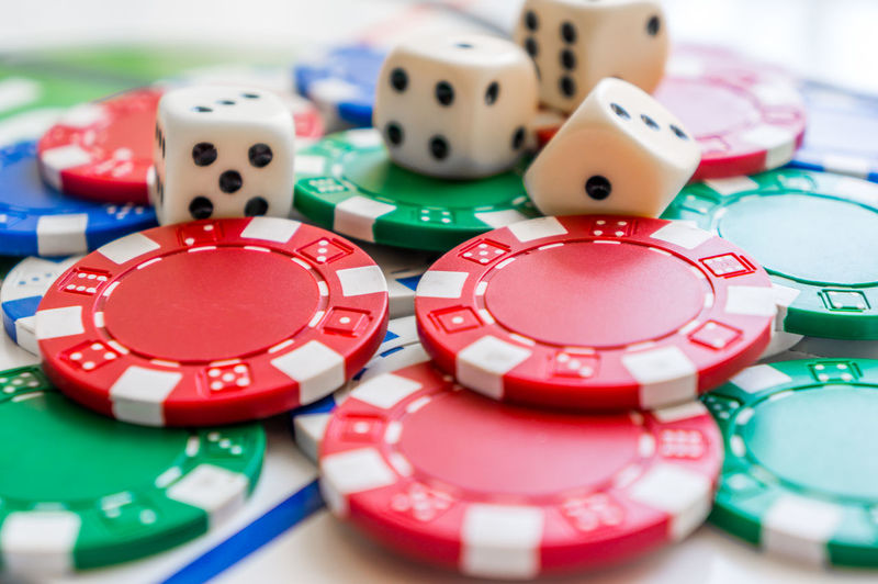 Close-up of dice with gambling chips