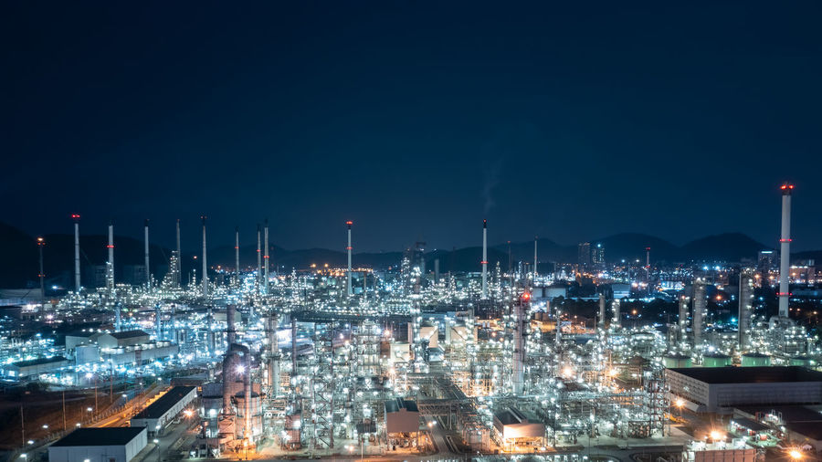 Oil and gas refinery plant or petrochemical industry at night sky, manufacturing of petroleum 