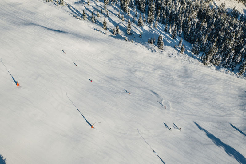 High angle view of people skiing on snow